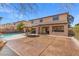 Spacious backyard featuring a covered patio, large pool and open area perfect for outdoor activities at 6136 Stanton Summit Dr, North Las Vegas, NV 89081