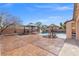 Expansive backyard with a pool, outdoor seating area, and lush landscaping for entertaining at 6136 Stanton Summit Dr, North Las Vegas, NV 89081