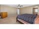 Well-lit bedroom with carpet, large bed, and a view of the bathroom at 6136 Stanton Summit Dr, North Las Vegas, NV 89081