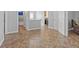 Open floor plan features ceramic tile and a view of the hall and laundry area at 6136 Stanton Summit Dr, North Las Vegas, NV 89081