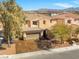 Beautiful two-story home with three-car garage, manicured front yard, in a well-maintained neighborhood at 6136 Stanton Summit Dr, North Las Vegas, NV 89081