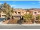 Beautiful two-story home featuring a three-car garage and a well-manicured front yard at 6136 Stanton Summit Dr, North Las Vegas, NV 89081