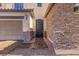 Close up of a home's entry featuring a decorative front door and stone accents at 6136 Stanton Summit Dr, North Las Vegas, NV 89081