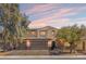 Beautiful two-story home with a three-car garage, well-manicured landscaping, and inviting curb appeal at 6136 Stanton Summit Dr, North Las Vegas, NV 89081