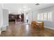 Open kitchen area with breakfast bar, tile backsplash, and wood table at 6136 Stanton Summit Dr, North Las Vegas, NV 89081