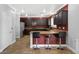 Spacious kitchen area with breakfast bar and dark wood cabinetry at 6136 Stanton Summit Dr, North Las Vegas, NV 89081