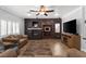 Cozy living room with stone accent wall, fireplace, and comfortable seating at 6136 Stanton Summit Dr, North Las Vegas, NV 89081