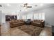 Spacious living room features tile floors, recessed lighting, and a ceiling fan at 6136 Stanton Summit Dr, North Las Vegas, NV 89081