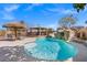 Inviting pool featuring a rock waterfall, slide, and ample space for lounging and entertainment at 6136 Stanton Summit Dr, North Las Vegas, NV 89081