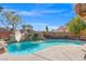 Sparkling pool boasts a rock waterfall feature, slide and is perfect for a refreshing dip and outdoor fun at 6136 Stanton Summit Dr, North Las Vegas, NV 89081
