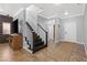 Elegant staircase in a home's entry area, leading to the upper level and nearby rooms at 6136 Stanton Summit Dr, North Las Vegas, NV 89081