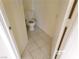 Cozy bathroom featuring tile flooring and a standard toilet fixture at 8379 Drop Camp St, Las Vegas, NV 89123