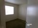 Bedroom with carpet and a window allowing natural light at 8379 Drop Camp St, Las Vegas, NV 89123