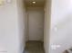 Hallway with tile flooring and neutral paint at 8379 Drop Camp St, Las Vegas, NV 89123