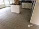 Kitchen featuring tile flooring, white cabinets, an island, and modern countertops at 8379 Drop Camp St, Las Vegas, NV 89123