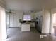 Bright kitchen with white cabinets, stainless steel appliances, and tile flooring at 8379 Drop Camp St, Las Vegas, NV 89123