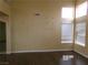 Open-concept living room featuring high ceilings, multiple windows and wood flooring at 8379 Drop Camp St, Las Vegas, NV 89123