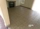 Spacious living room with tile flooring and a cozy fireplace at 8379 Drop Camp St, Las Vegas, NV 89123