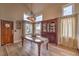 Bright dining room features wood floors, windows, and a decorative light fixture at 8953 Belconte Ln, Henderson, NV 89074