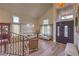 Bright foyer featuring high ceilings, lots of windows, wood floors, and elegant decor at 8953 Belconte Ln, Henderson, NV 89074