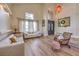 Bright foyer featuring wood floors, lots of windows, and elegant decor at 8953 Belconte Ln, Henderson, NV 89074