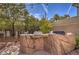Outdoor grill station features natural rock facade, perfect for entertaining in your private backyard at 8953 Belconte Ln, Henderson, NV 89074
