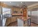 Kitchen features stainless steel appliances, granite counters, and a center island at 8953 Belconte Ln, Henderson, NV 89074