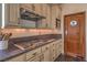 Gourmet kitchen with granite countertops, stainless steel appliances, and custom cabinetry at 8953 Belconte Ln, Henderson, NV 89074