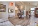 Spacious living area featuring wood floors, neutral decor, and a view of the staircase at 8953 Belconte Ln, Henderson, NV 89074