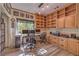 Spacious home office with built-in shelving, desk space, and natural light at 8953 Belconte Ln, Henderson, NV 89074