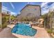 Custom pool with a rock waterfall and a separate spa offers the perfect backyard for relaxation at 8953 Belconte Ln, Henderson, NV 89074