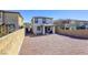 View of backyard with a gravel yard surrounded by tall block fencing at 909 Cirrus Cloud Ave, Las Vegas, NV 89138