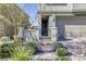 Close up shot of a gate and front door of a beautiful home at 909 Cirrus Cloud Ave, Las Vegas, NV 89138