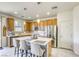 Bright kitchen with stainless steel appliances, kitchen island and bar stool seating at 909 Cirrus Cloud Ave, Las Vegas, NV 89138