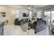 Spacious living room featuring a ceiling fan and sliding doors at 909 Cirrus Cloud Ave, Las Vegas, NV 89138