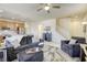 Open concept living room with tile floors and view into the kitchen at 909 Cirrus Cloud Ave, Las Vegas, NV 89138