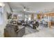 Open concept living room with modern furniture and a view into the kitchen at 909 Cirrus Cloud Ave, Las Vegas, NV 89138