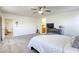 Large main bedroom with ensuite bathroom featuring ceiling fan and large windows at 909 Cirrus Cloud Ave, Las Vegas, NV 89138