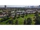 Aerial view of a vibrant residential area with lush green golf course, trees, and city skyline at 914 Tam O Shanter, Las Vegas, NV 89109