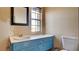 Bathroom showcasing a sink vanity, mirror, and a window at 914 Tam O Shanter, Las Vegas, NV 89109