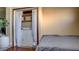 Functional bedroom featuring in-unit laundry and compact living space with a washer and dryer setup at 914 Tam O Shanter, Las Vegas, NV 89109