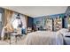 Spacious bedroom with a large window, featuring decor and furniture for relaxation and productivity at 914 Tam O Shanter, Las Vegas, NV 89109