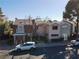 Exterior view of townhomes, showcasing well-maintained landscaping and convenient parking spaces at 914 Tam O Shanter, Las Vegas, NV 89109