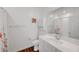Clean bathroom featuring a white vanity, toilet, vanity storage, and shower with a floral shower curtain at 965 Nevada State Dr # 38202, Henderson, NV 89002