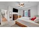 Bedroom showing dresser, window, ceiling fan, wood bed frame, neutral carpet, and natural light at 965 Nevada State Dr # 38202, Henderson, NV 89002