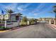 View of the Waverly community entrance with palm trees and desert landscaping, showcasing a welcoming environment at 965 Nevada State Dr # 38202, Henderson, NV 89002