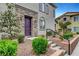 Charming front entrance with stone accents, landscaped garden, and a well-maintained walkway leading to the front door at 965 Nevada State Dr # 38202, Henderson, NV 89002