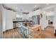 Bright kitchen with stainless steel appliances, white cabinets, and a granite countertop island with seating at 965 Nevada State Dr # 38202, Henderson, NV 89002