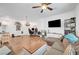 Well-lit living room with modern decor, a comfortable sofa, and a large television, perfect for relaxation at 965 Nevada State Dr # 38202, Henderson, NV 89002
