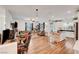 Spacious open-concept living room with hardwood floors, modern decor, and lots of natural light at 965 Nevada State Dr # 38202, Henderson, NV 89002